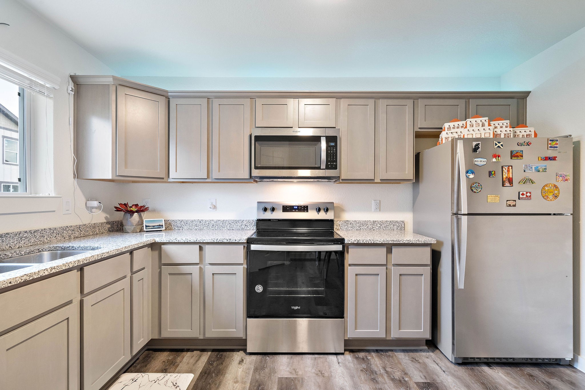 12603 Telge Road, Unit 17B Cypress, TX 77429 - Photo 2 of 21 a kitchen with a stove top oven and refrigerator