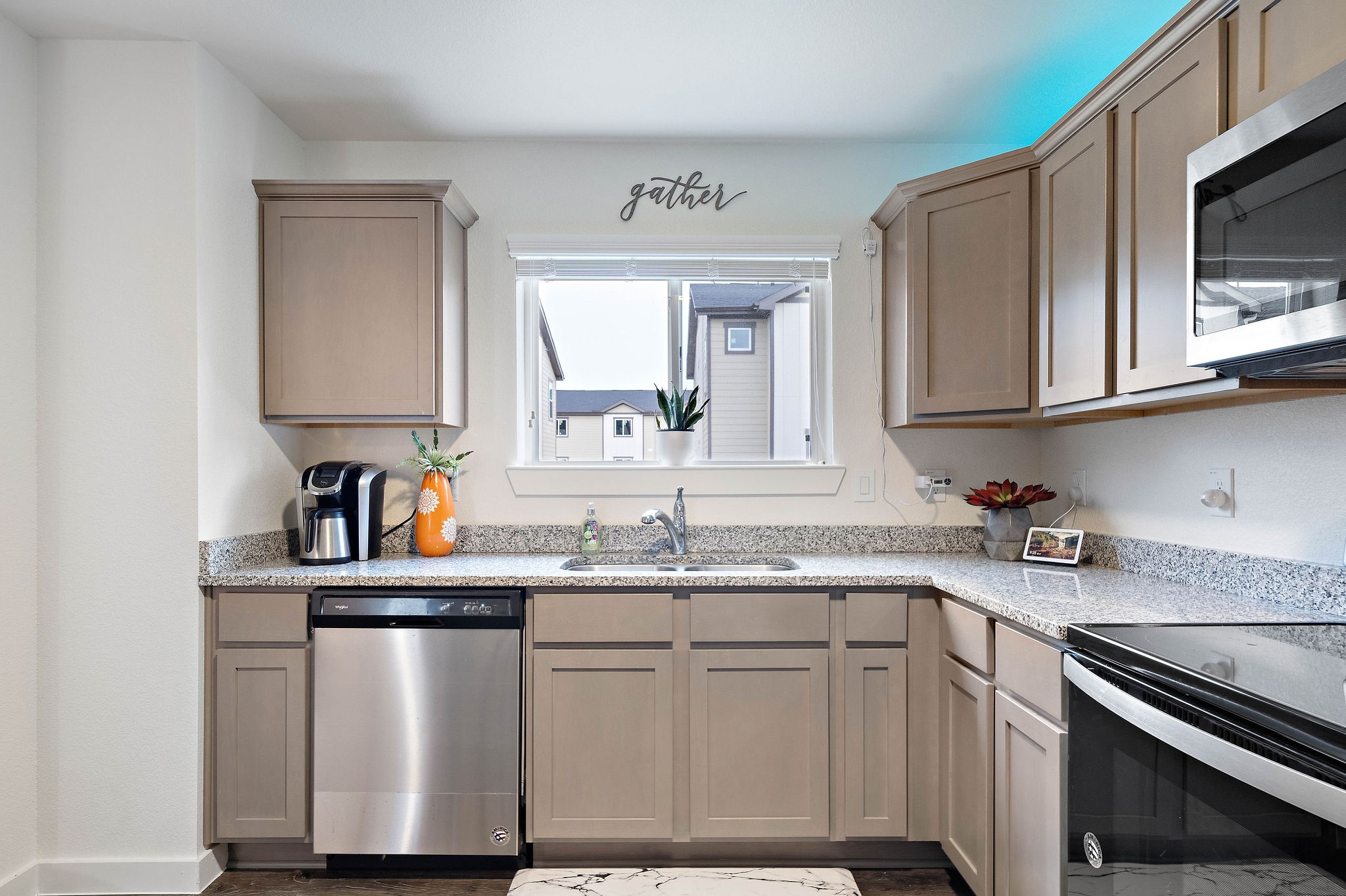 12603 Telge Road, Unit 17B Cypress, TX 77429 - Photo 8 of 21 a kitchen with stainless steel appliances granite countertop a sink stove and microwave