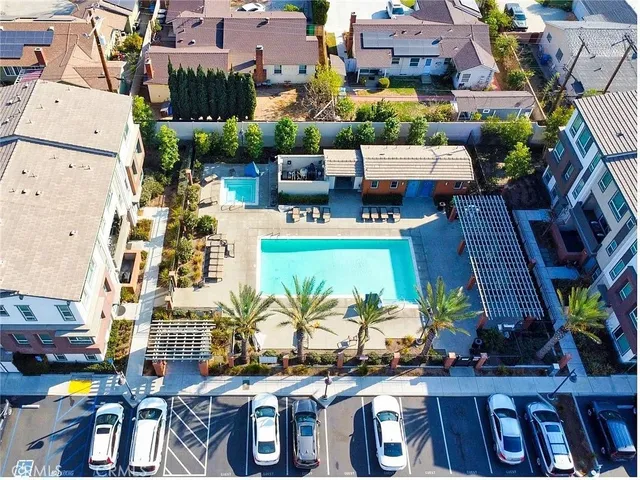 an aerial view of multiple houses with yard