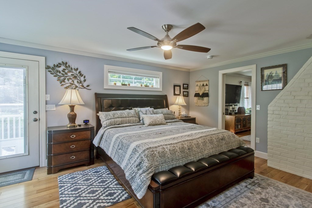 448 Tinkham Road Springfield, MA 01129 - Photo 8 of 32 a bedroom with a large bed and a chandelier