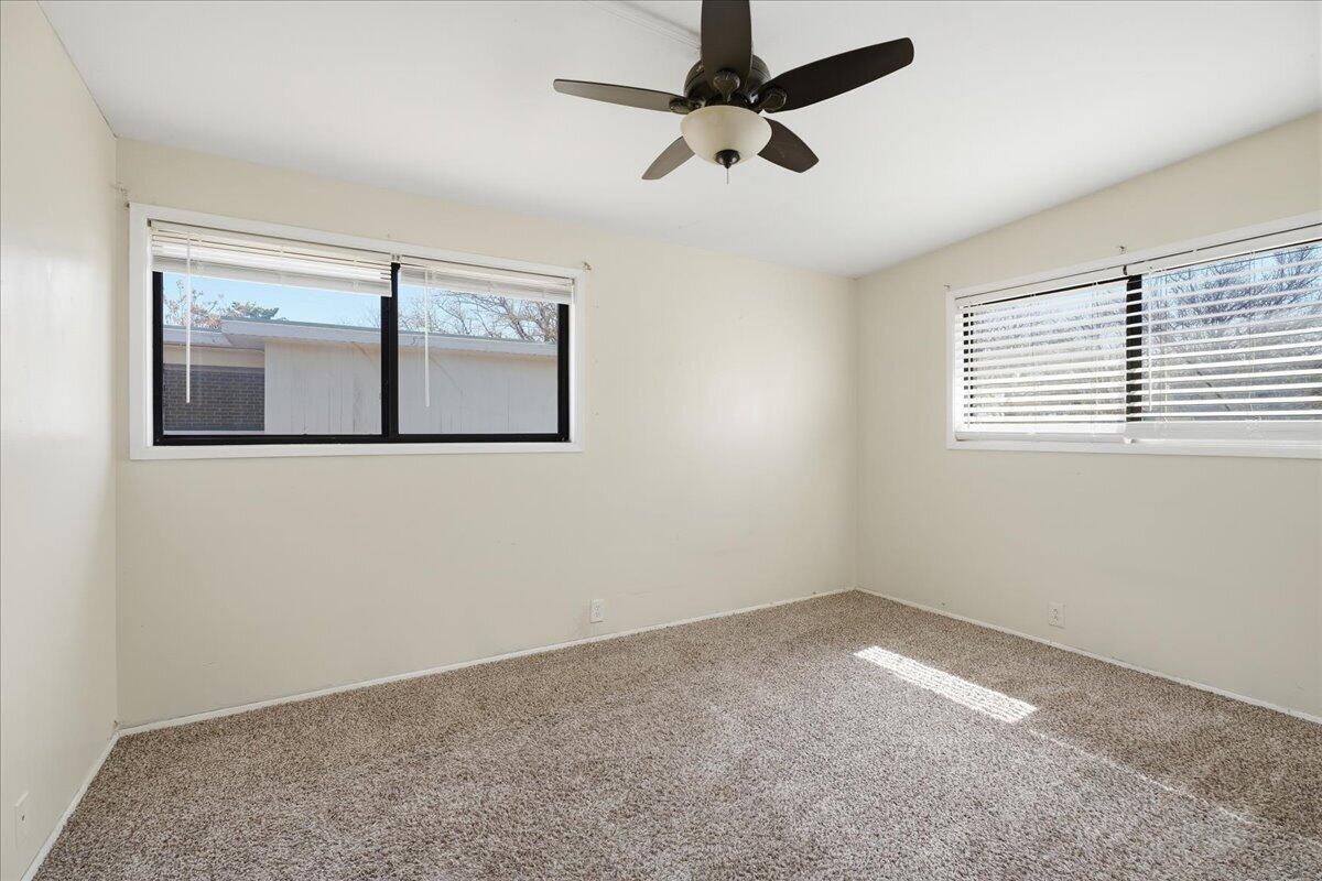 2706 68th Street Lubbock, TX 79413 - Photo 13 of 20 an empty room with a window