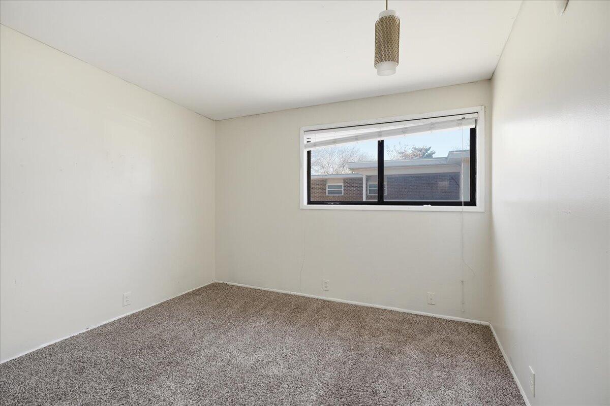 2706 68th Street Lubbock, TX 79413 - Photo 15 of 20 an empty room with a window