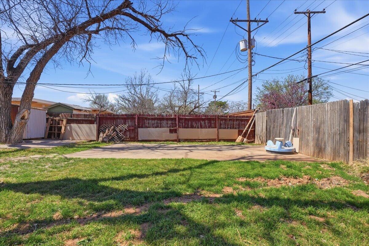 2706 68th Street Lubbock, TX 79413 - Photo 19 of 20 a view of a swimming pool with a yard