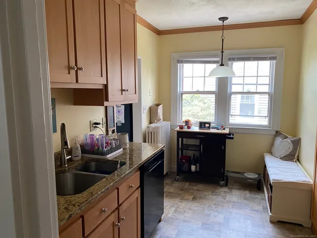 a kitchen with a sink and cabinets