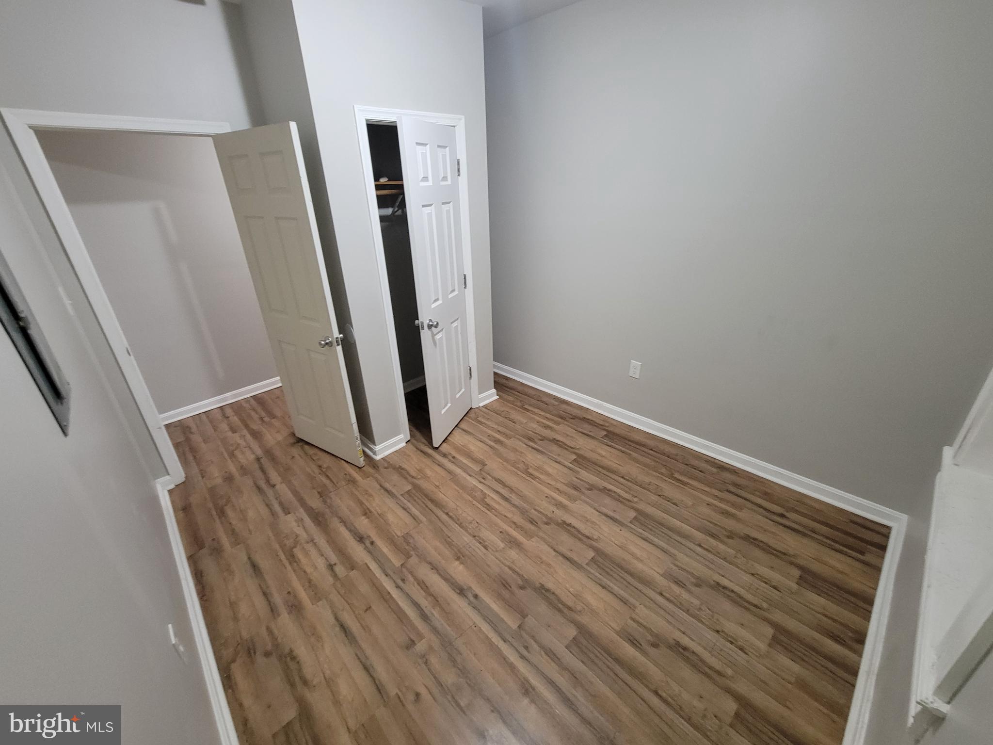 1217 Hollins Street, Unit 1 Baltimore, MD 21223 - Photo 5 of 6 wooden floor in a gallery