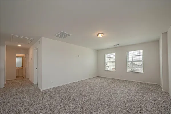 a view of empty room with windows