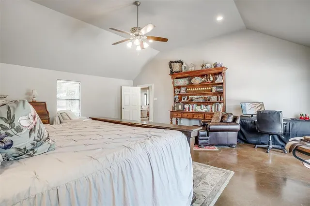 a bedroom with a bed furniture and decor