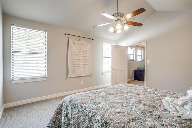 a bedroom with bed and window