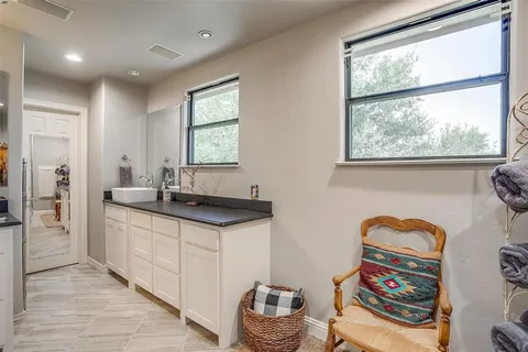 a bathroom with a sink double vanity and a two mirror
