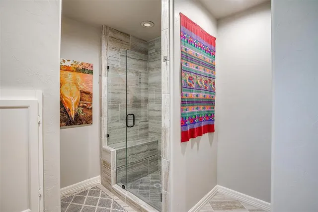 a bathroom with a shower and a sink