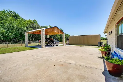 a view of a house with backyard and porch
