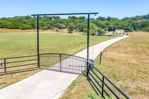 a view of a balcony with floor to ceiling windows yard and ocean view