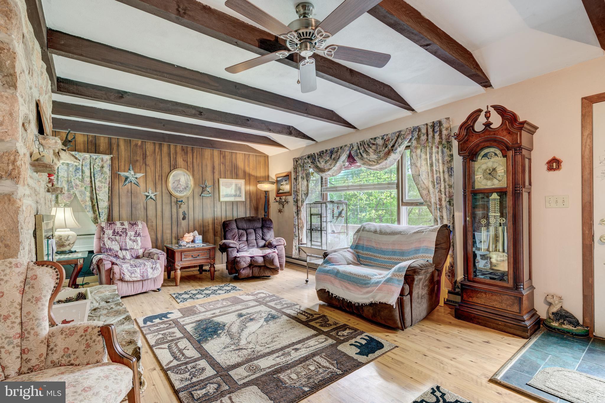 4140 Trump Road Westminster, MD 21158 - Photo 3 of 46 Living room w/ceiling fan, stone fireplace