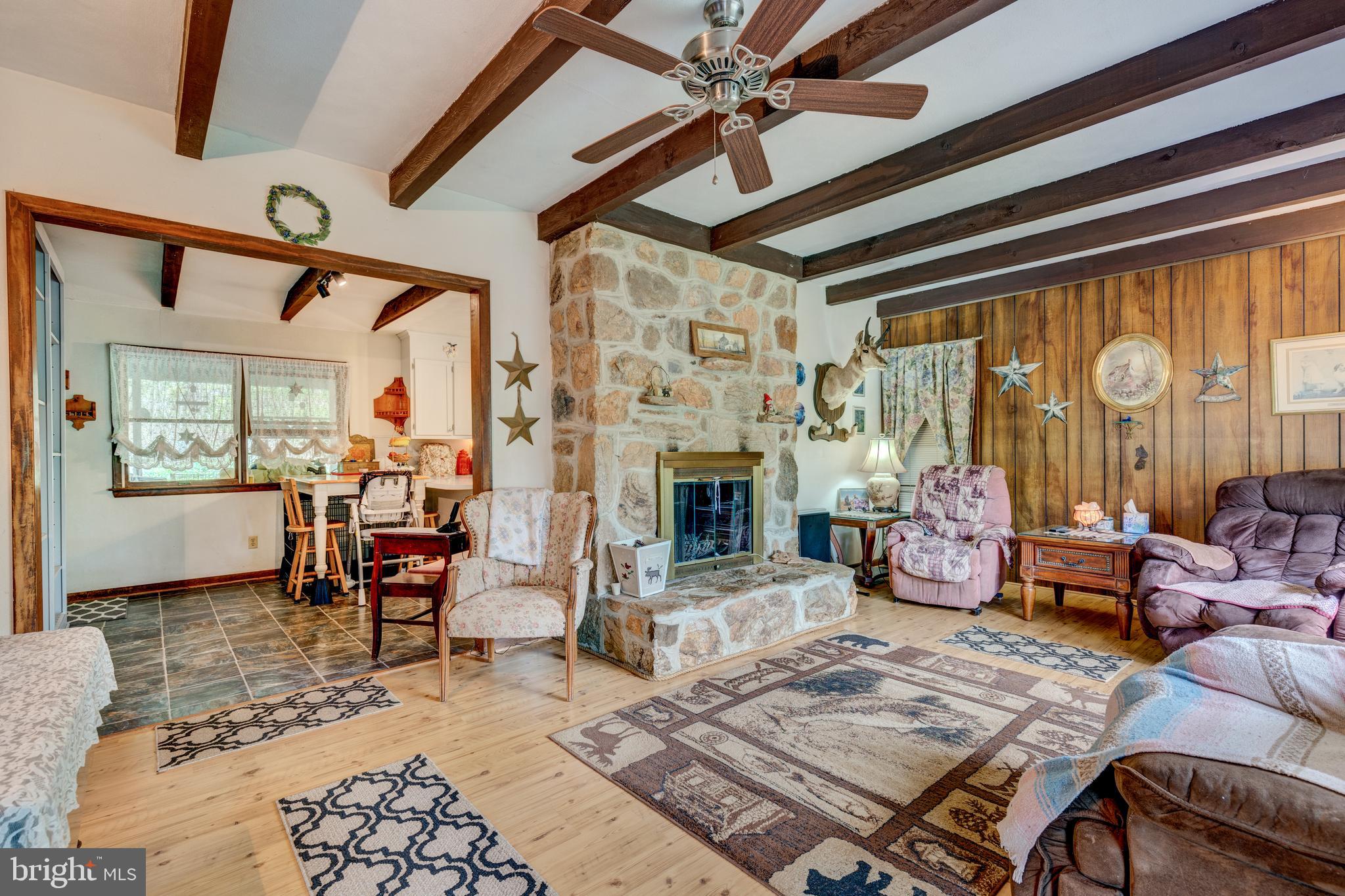 4140 Trump Road Westminster, MD 21158 - Photo 4 of 46 Living room with beam ceilings, stone fireplace