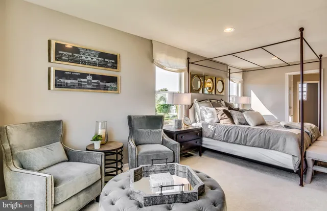 a living room with furniture and a lamp