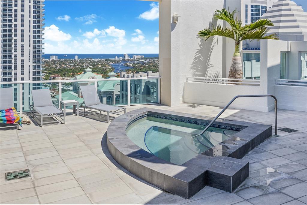 a view of a swimming pool with a lounge chair