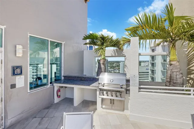a lobby with furniture and a rug