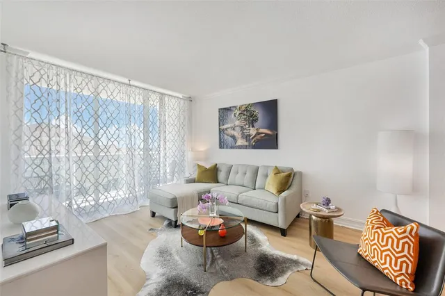 a living room with furniture and a window