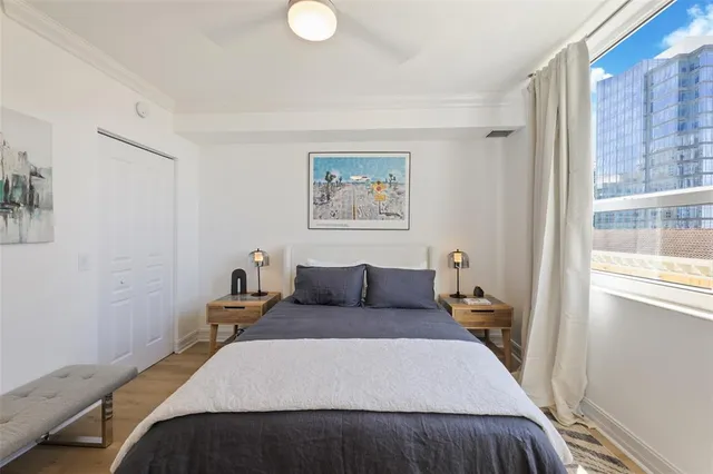 a bedroom with a bed and a window