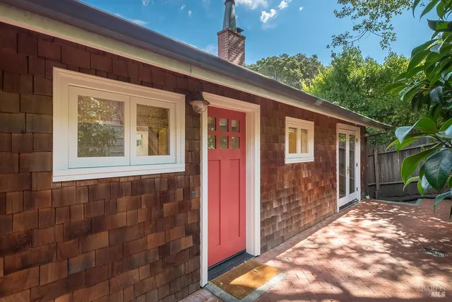 a view of a yard with large trees
