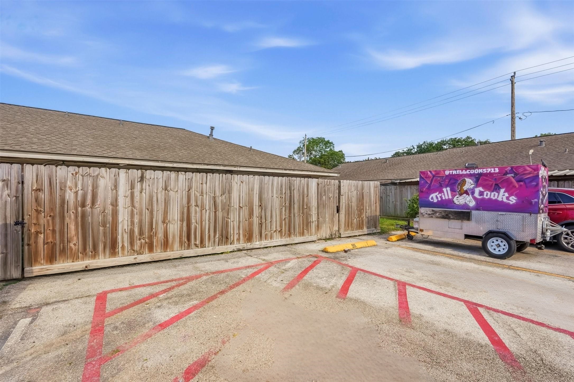 9458 Neuens Road, Unit 9458 Houston, TX 77080 - Photo 21 of 22 Back Exterior. Assigned parking spot #56 located directly in front of patio door. Fence replaced in 2023!