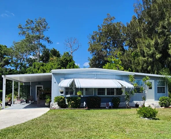 a bathroom with a sink mirror vanity and toilet