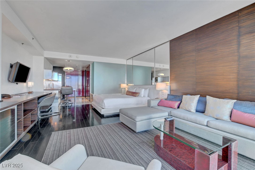 4381 West Flamingo Road, Unit 1206 Las Vegas, NV 89103 - Photo 10 of 27 Living area with wood finished floors