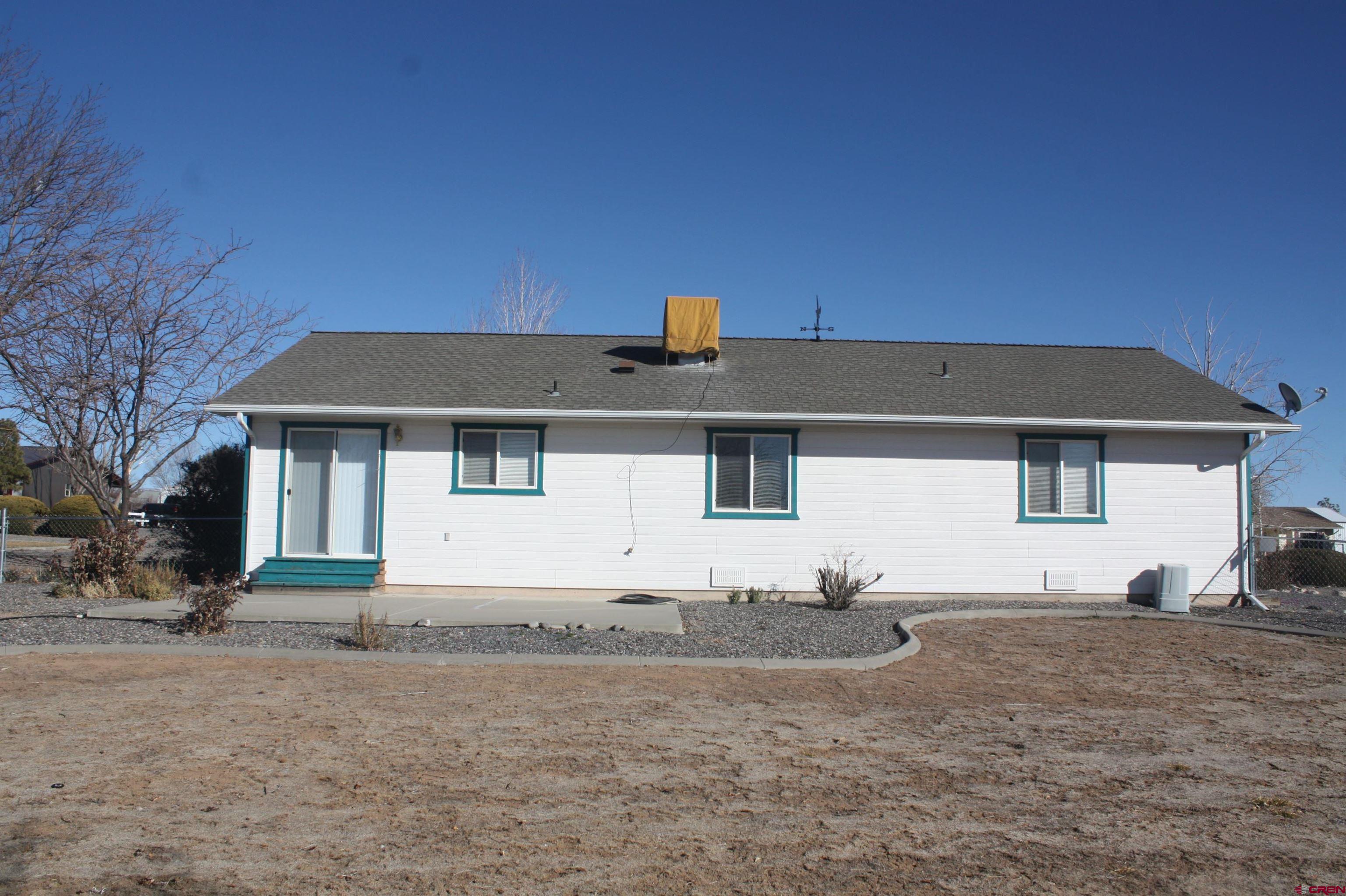 20623 Del Ray Drive Eckert, CO 81418 - Photo 2 of 22 a front view of a house with a yard