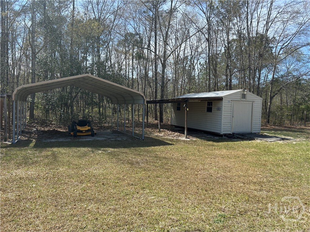103 Ellis Drive Rincon, GA 31326 - Photo 13 of 15 out building and awning