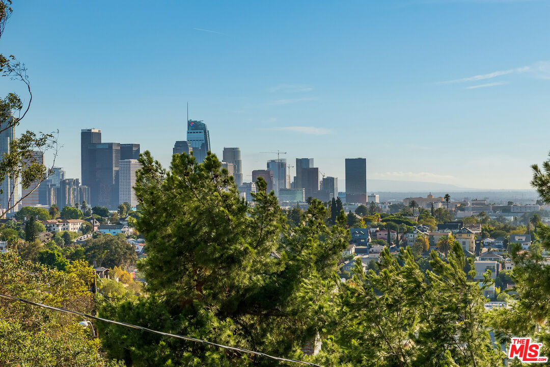 a view of a city with tall buildings in the background