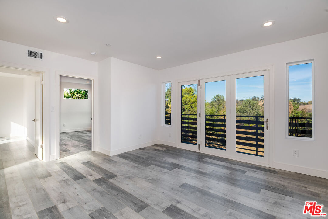 1663 Sargent Court Los Angeles, CA 90026 - Photo 14 of 20 wooden floor in an empty room with a window