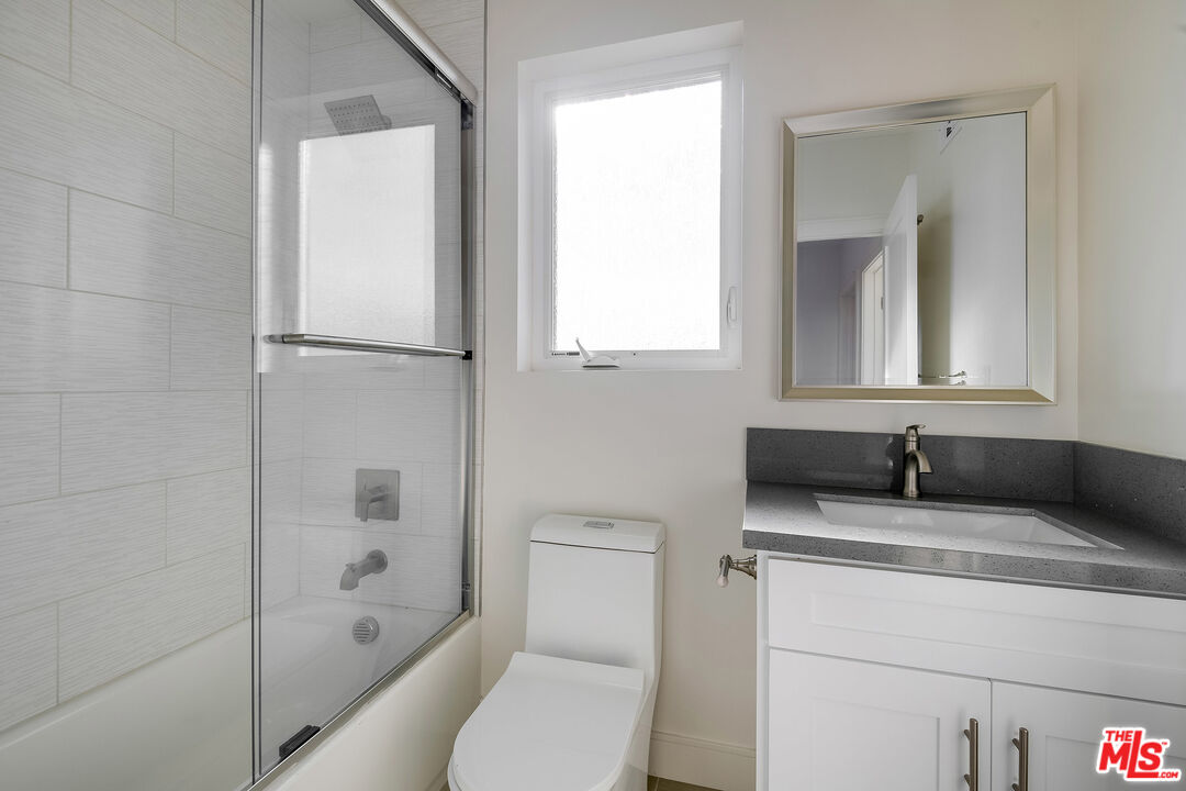 1663 Sargent Court Los Angeles, CA 90026 - Photo 15 of 20 a bathroom with a granite countertop sink toilet and shower