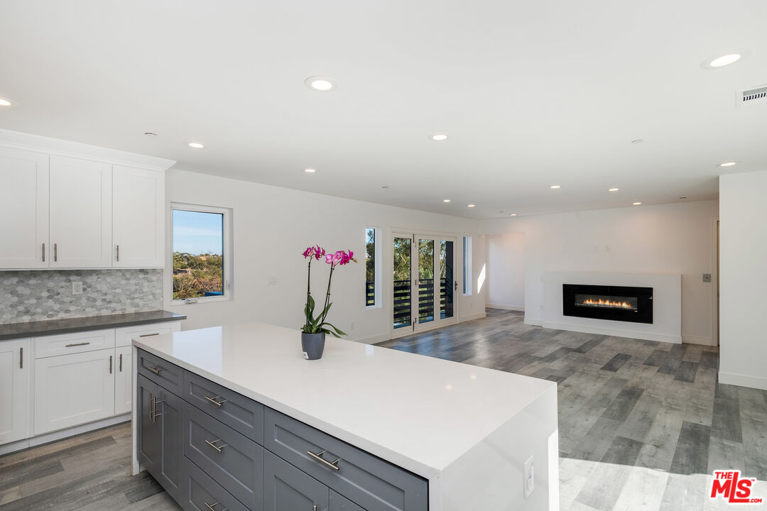 1663 Sargent Court Los Angeles, CA 90026 - Photo 3 of 20 a kitchen with stainless steel appliances granite countertop a sink and a refrigerator