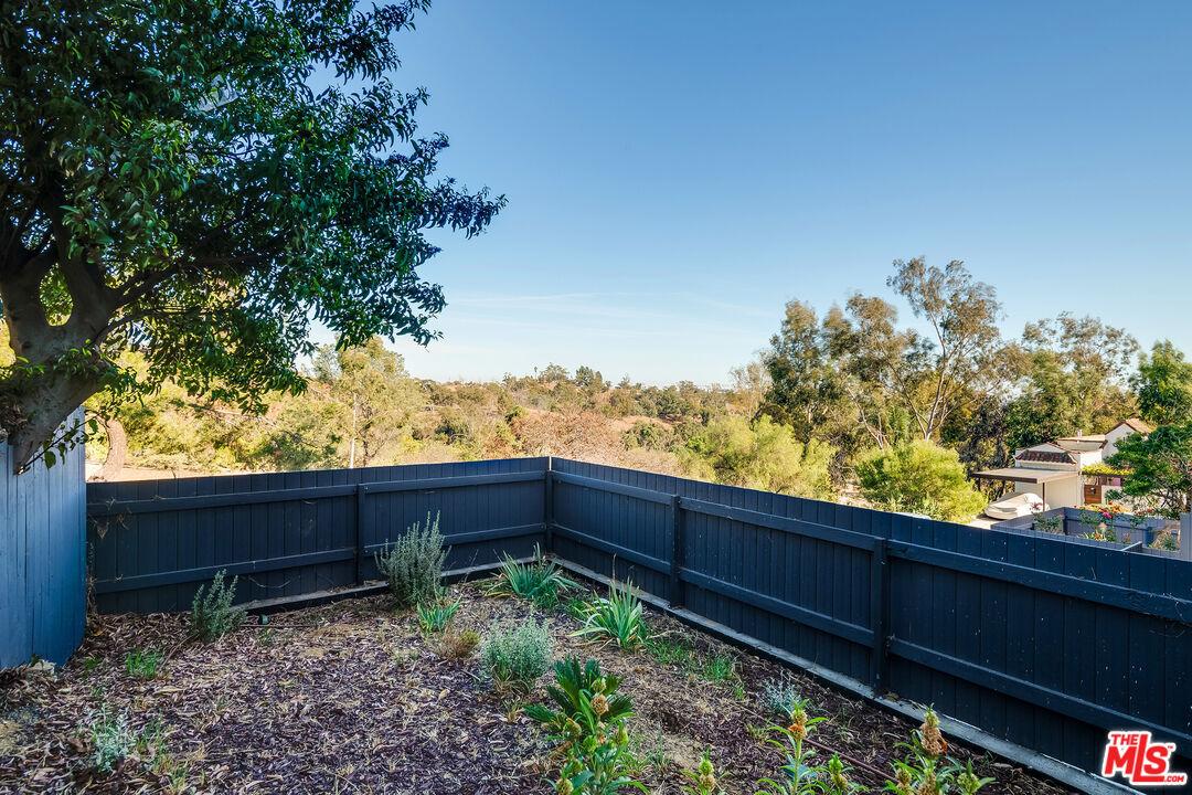 1663 Sargent Court Los Angeles, CA 90026 - Photo 10 of 20 a wooden fence with trees in the background
