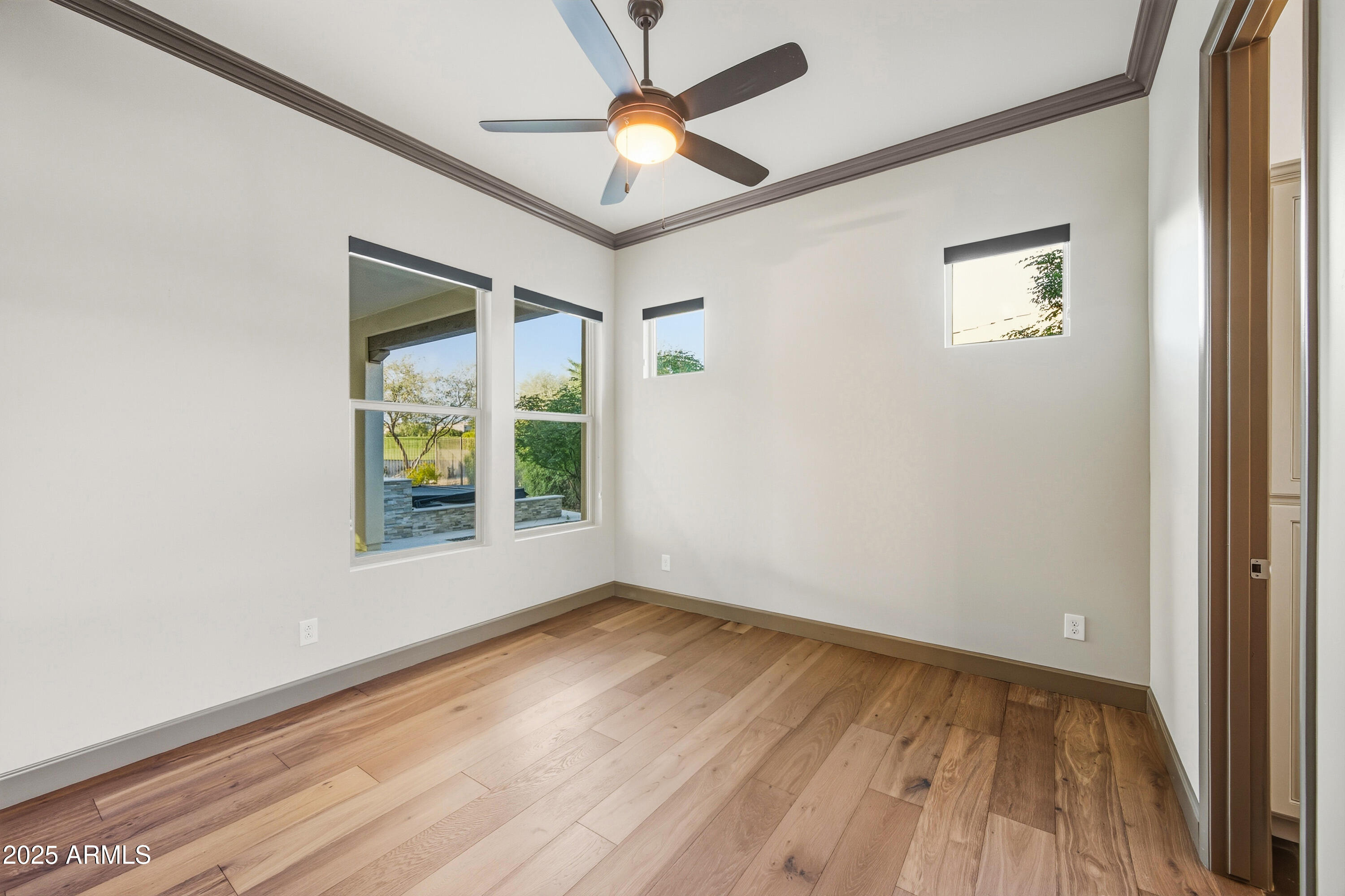 17856 East Vista Desierto Rio Verde, AZ 85263 - Photo 11 of 46 a view of an empty room with window and wooden floor