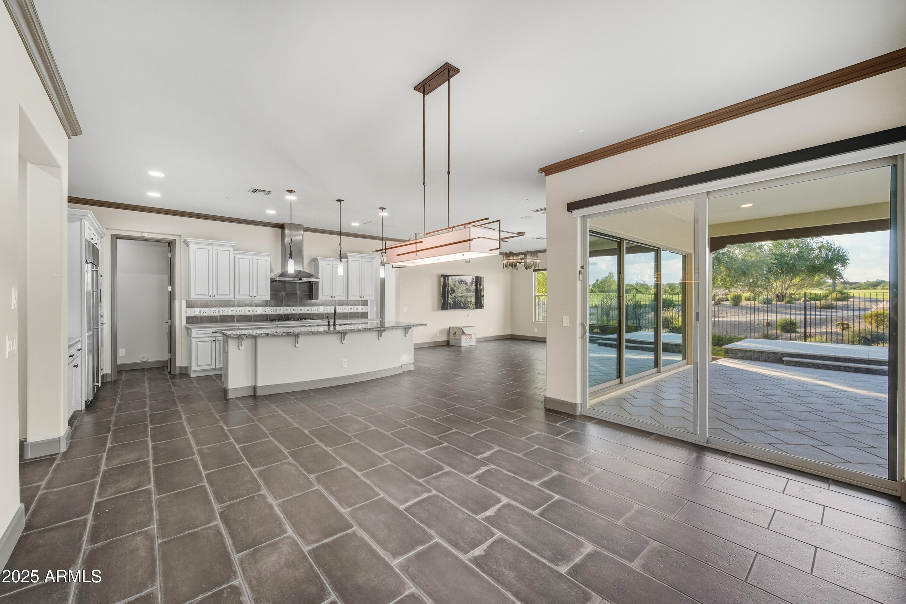 17856 East Vista Desierto Rio Verde, AZ 85263 - Photo 19 of 46 a view of a kitchen with kitchen island a counter top space a sink and stainless steel appliances