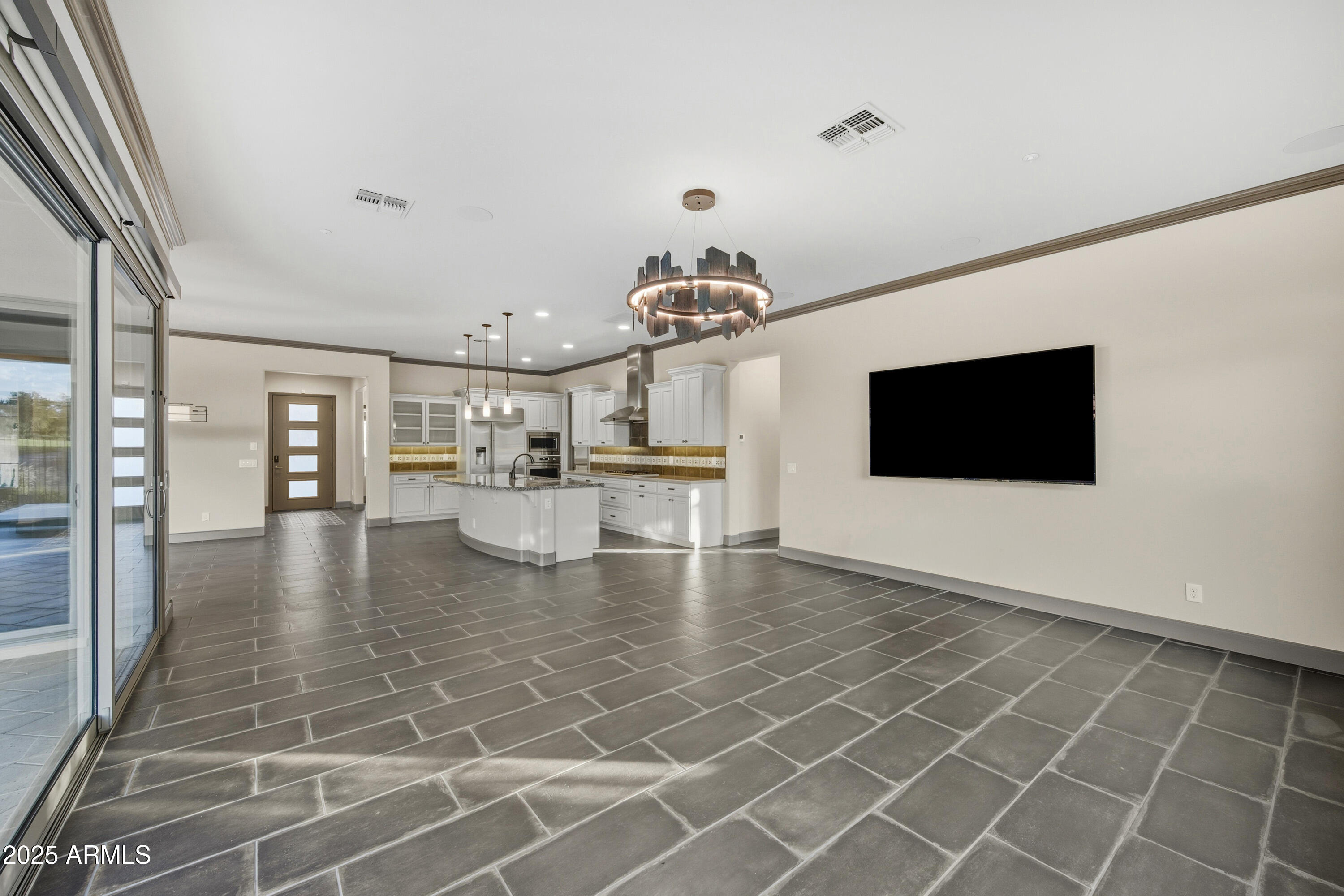 17856 East Vista Desierto Rio Verde, AZ 85263 - Photo 21 of 46 a view of a living room a flat screen tv and kitchen view