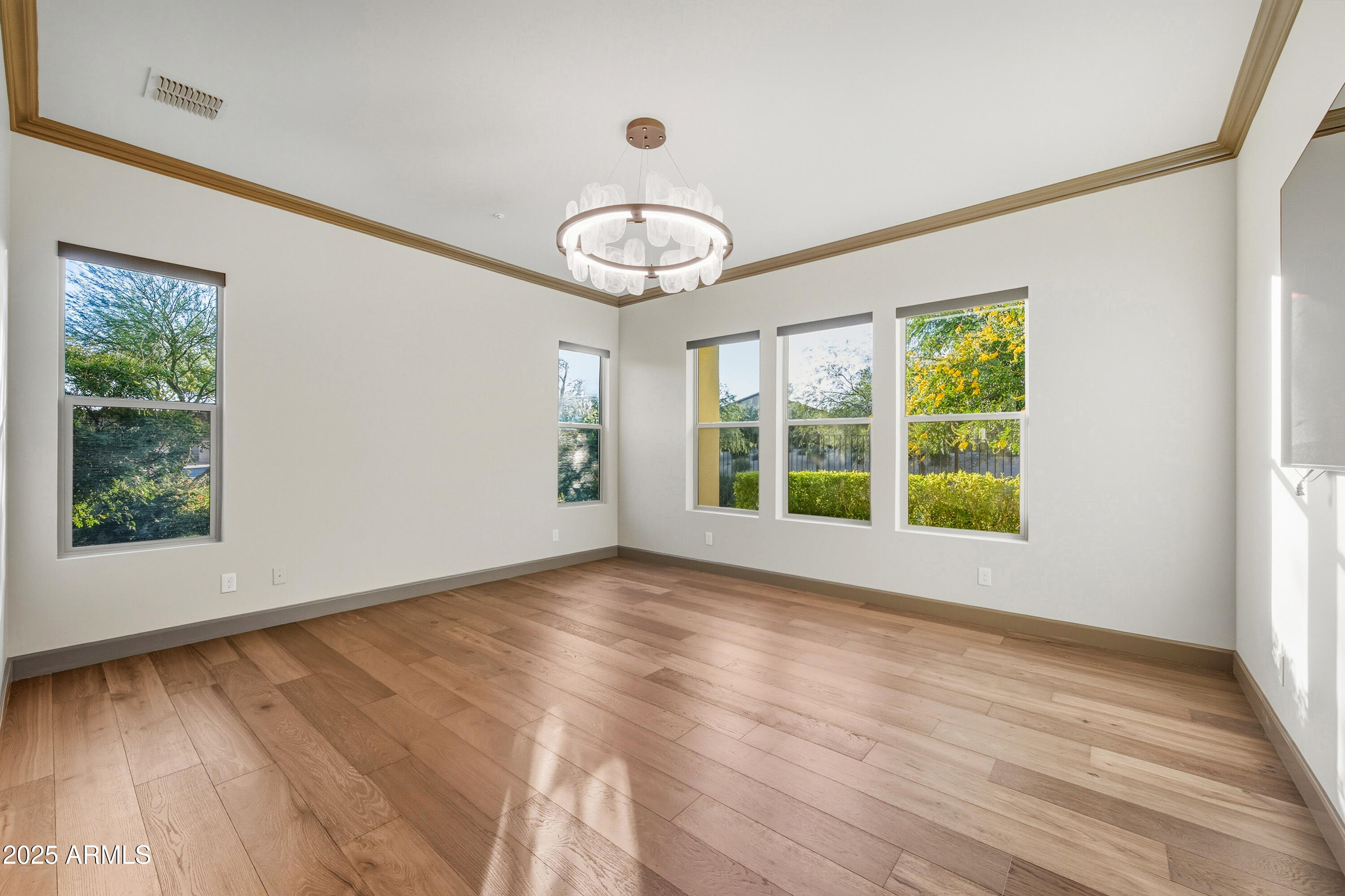 17856 East Vista Desierto Rio Verde, AZ 85263 - Photo 23 of 46 a view of an empty room with wooden floor and a window