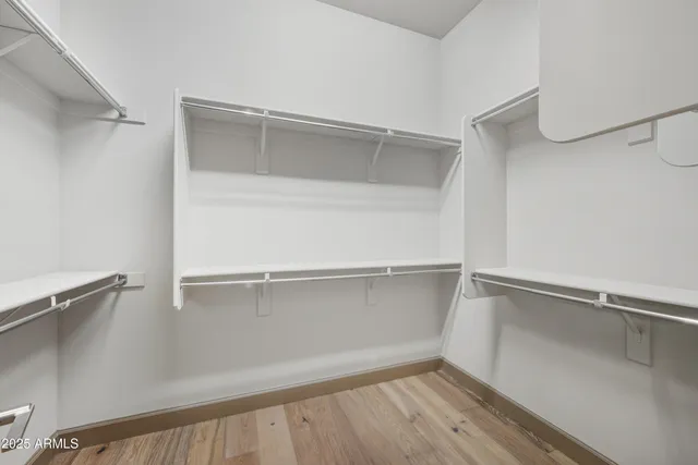 a view of an empty walk in closet