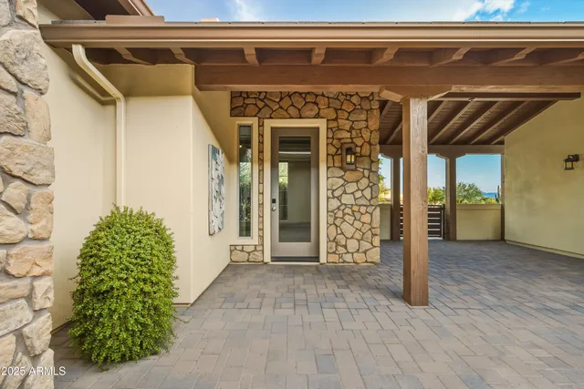 a view of a swimming pool with an outdoor space and seating area