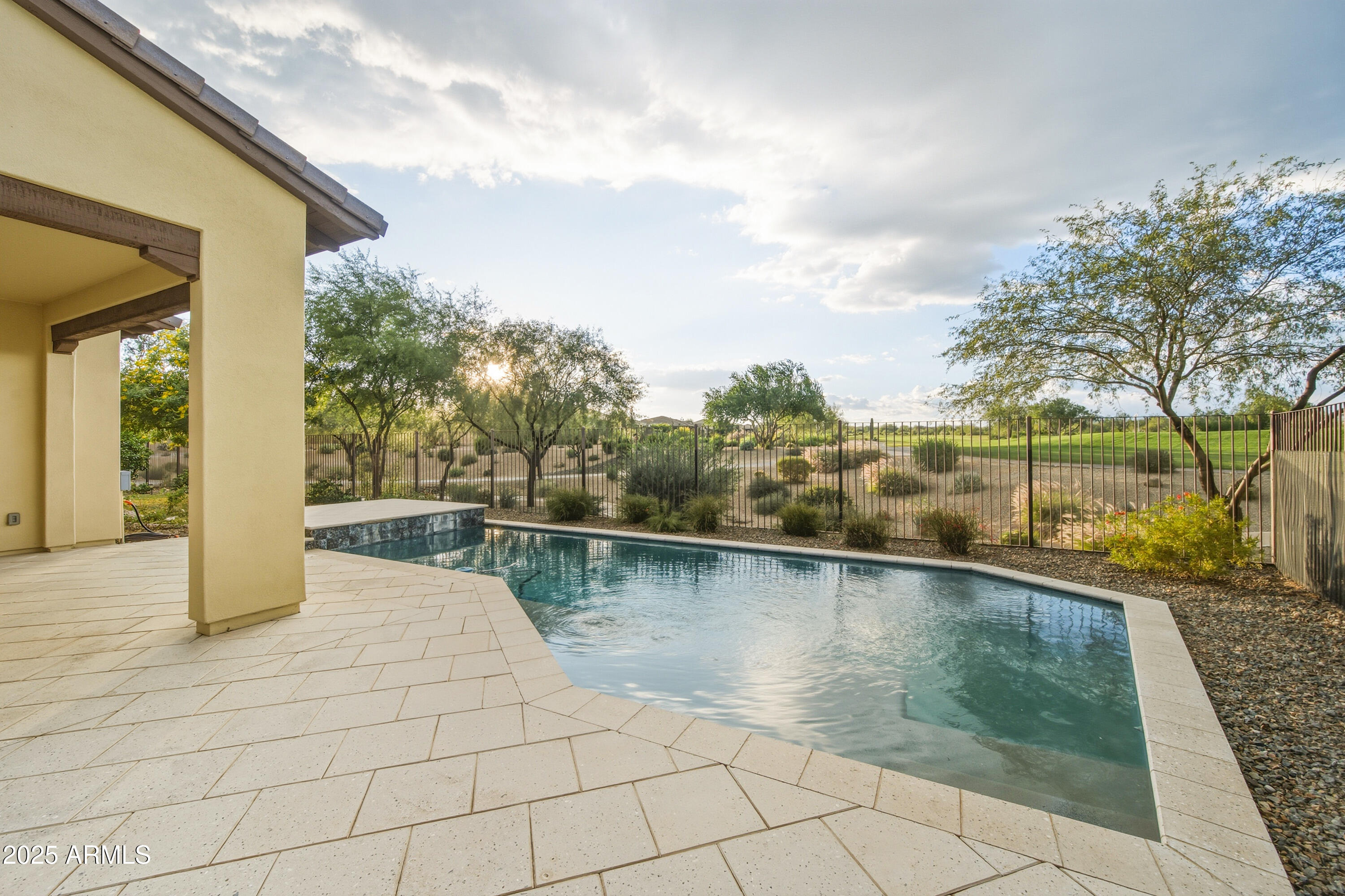 17856 East Vista Desierto Rio Verde, AZ 85263 - Photo 34 of 46 a view of a swimming pool with an outdoor space and seating area