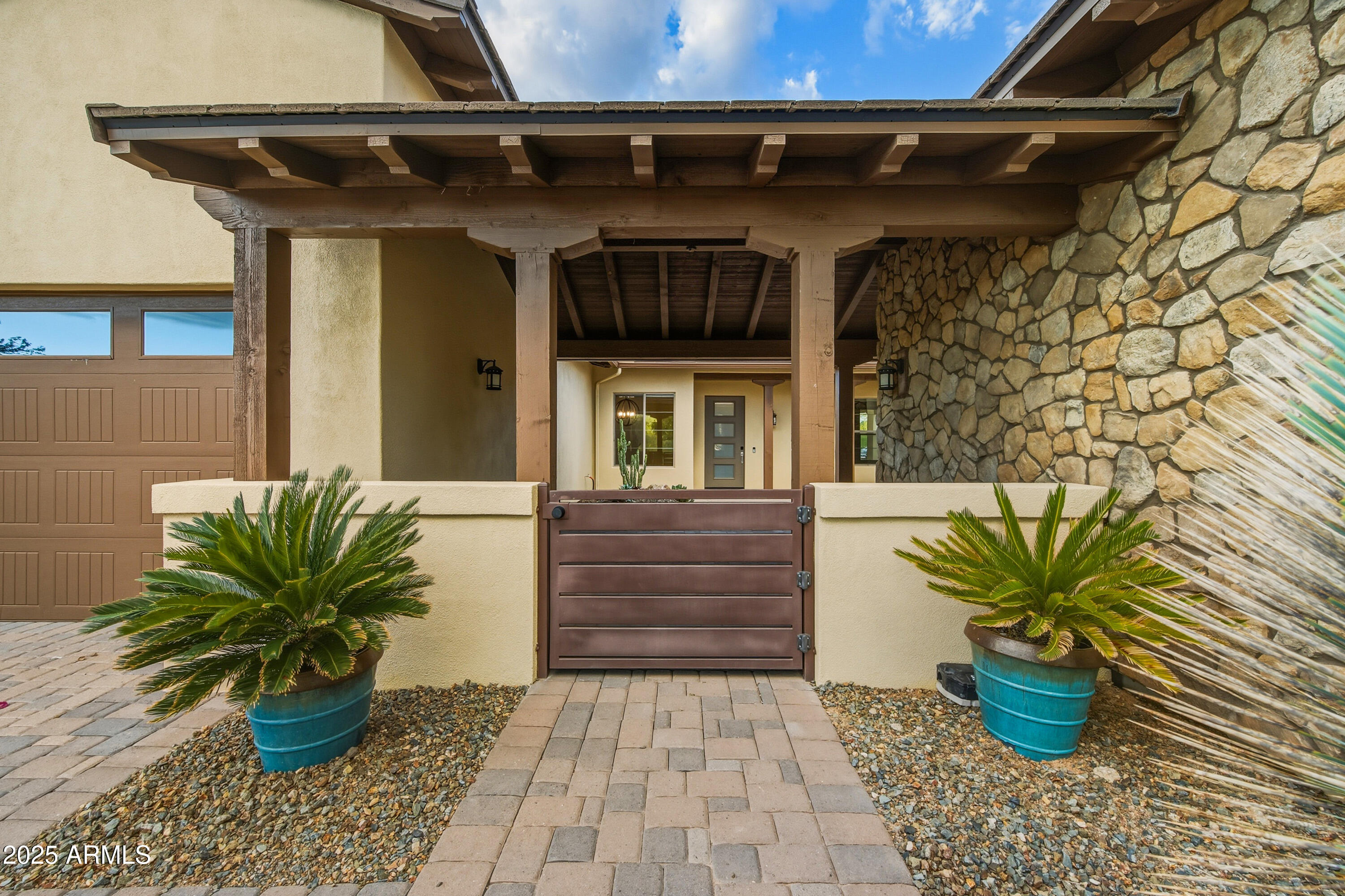 17856 East Vista Desierto Rio Verde, AZ 85263 - Photo 4 of 46 a potted plant sitting in front of a house