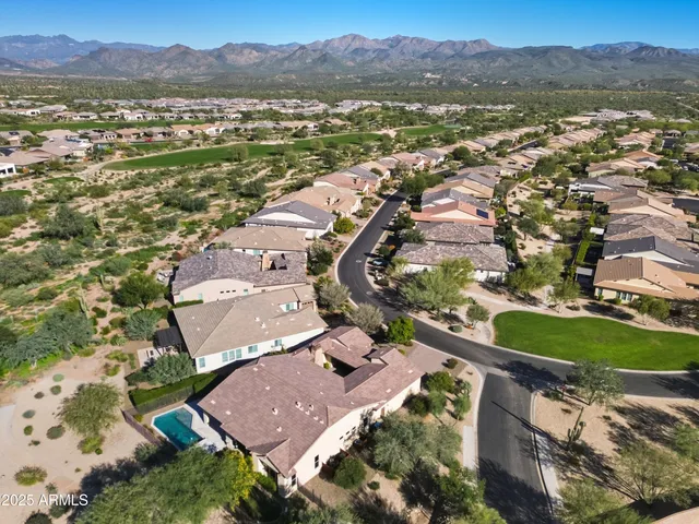 an aerial view of residential houses with outdoor space