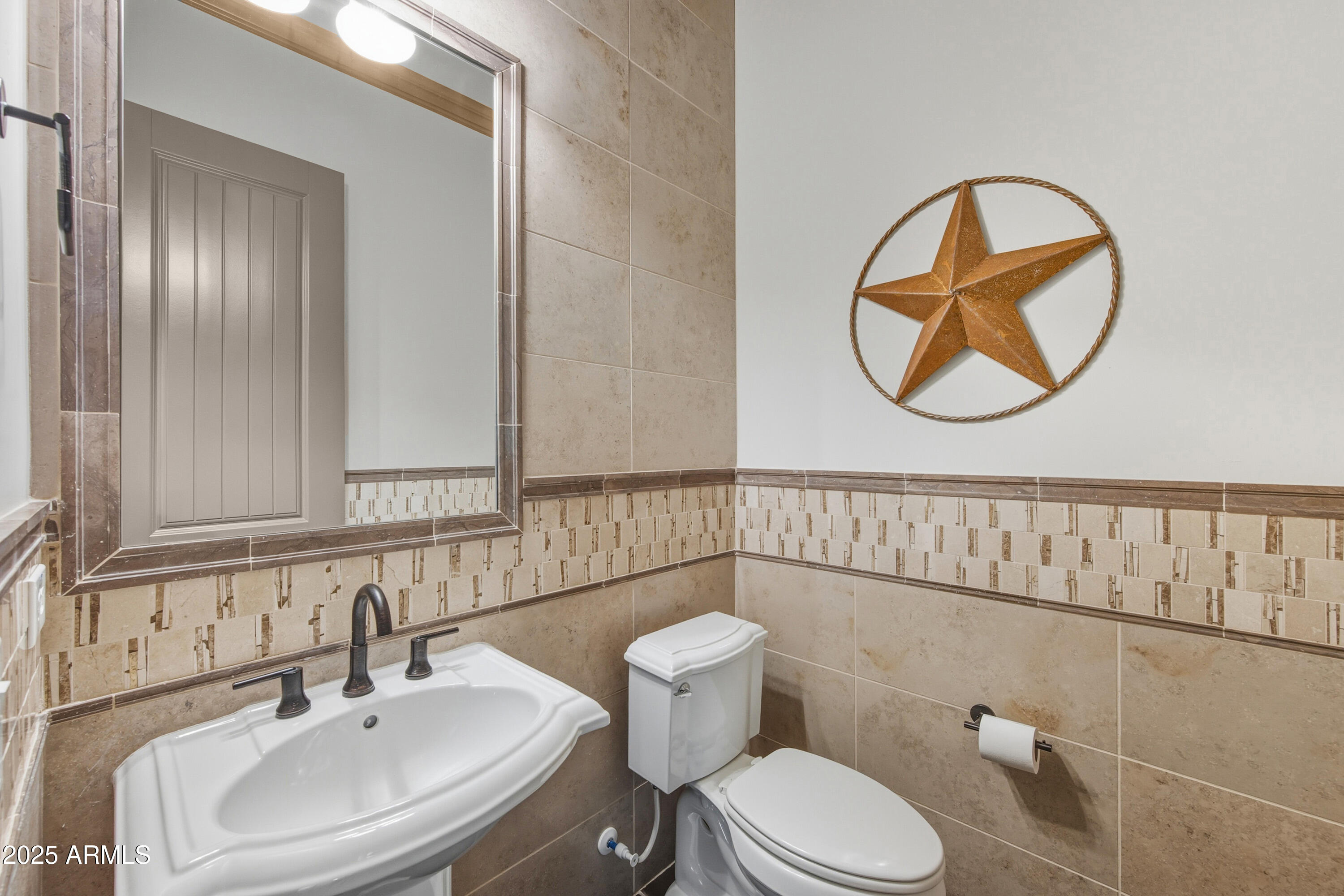 17856 East Vista Desierto Rio Verde, AZ 85263 - Photo 10 of 46 a bathroom with a toilet a sink and mirror