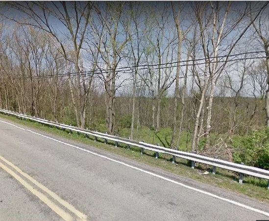 a view of a balcony with trees