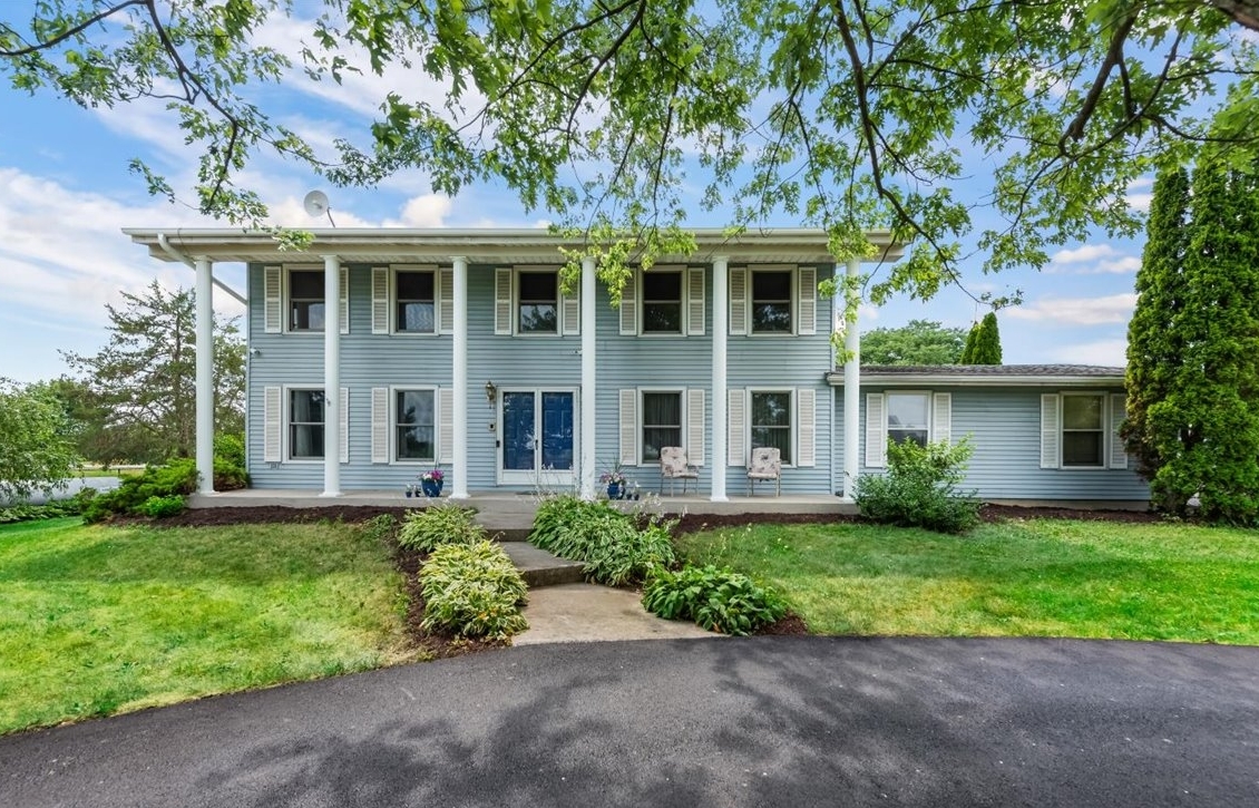 front view of a house with a yard
