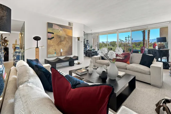 a living room with furniture and a large window