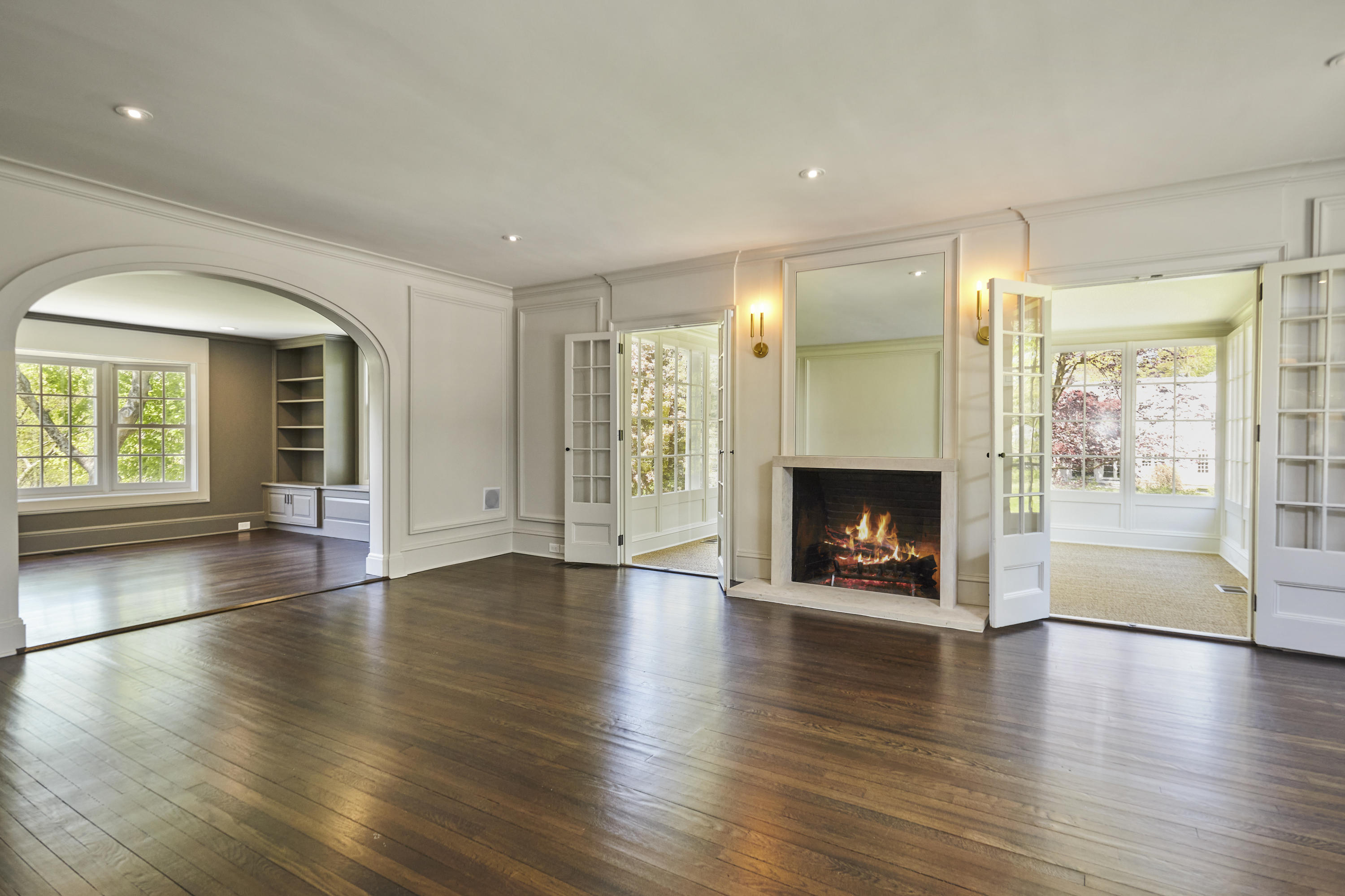 756 Ponus Ridge Road New Canaan, CT 06840 - Photo 2 of 54 an empty room with wooden floor and a fireplace