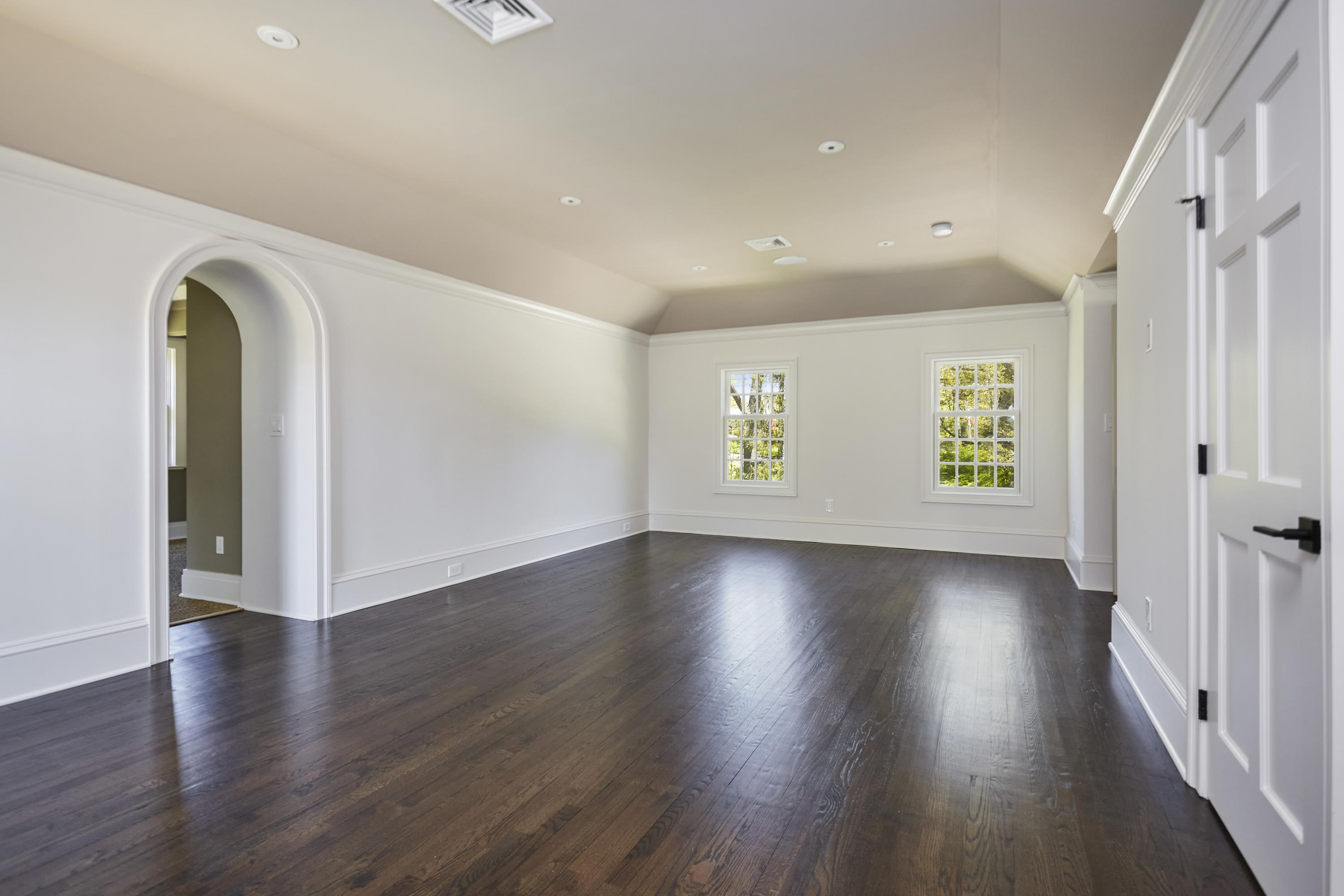 756 Ponus Ridge Road New Canaan, CT 06840 - Photo 21 of 54 an empty room with wooden floor and windows