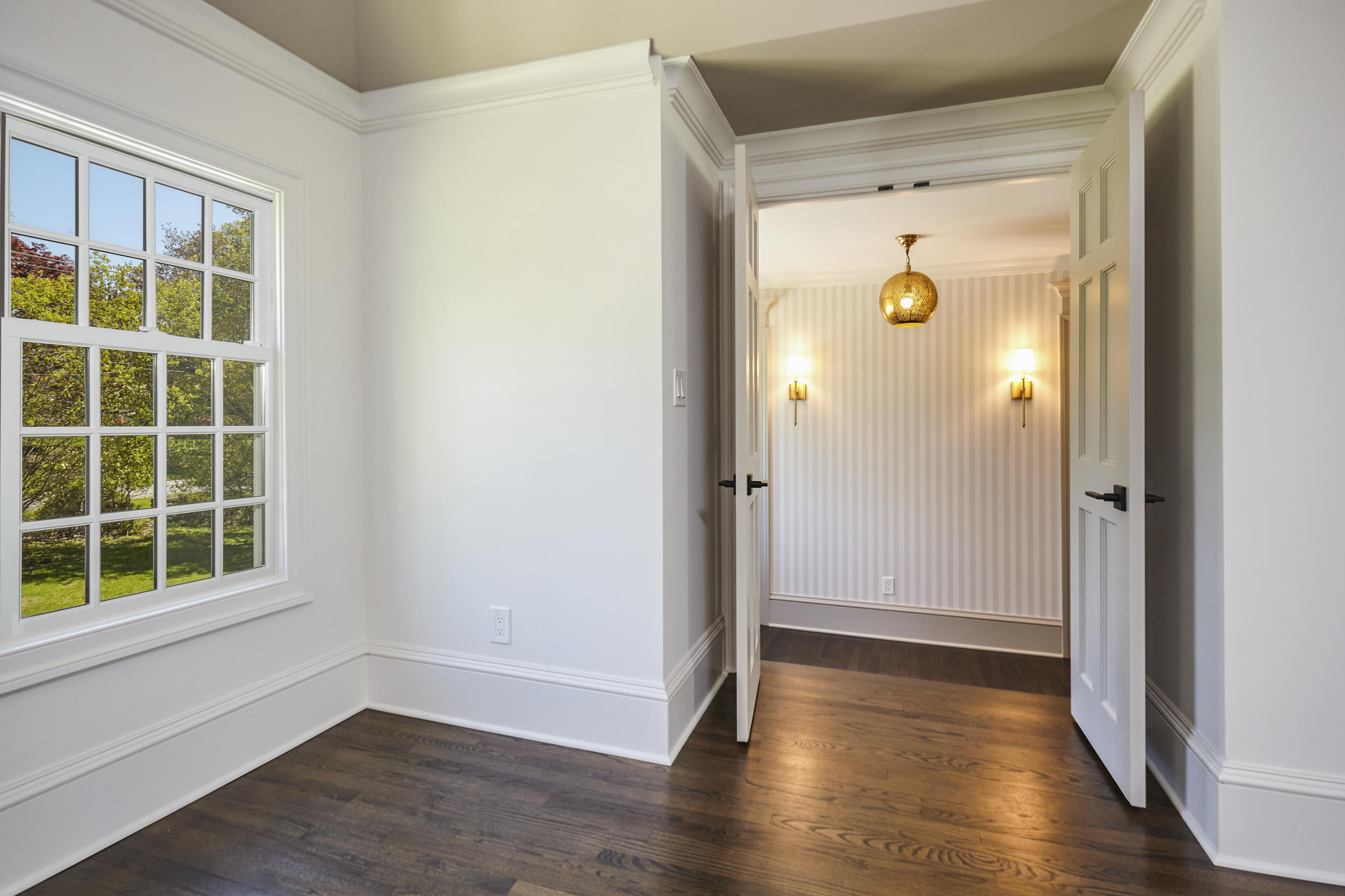 756 Ponus Ridge Road New Canaan, CT 06840 - Photo 25 of 54 a view of empty room with wooden floor and window